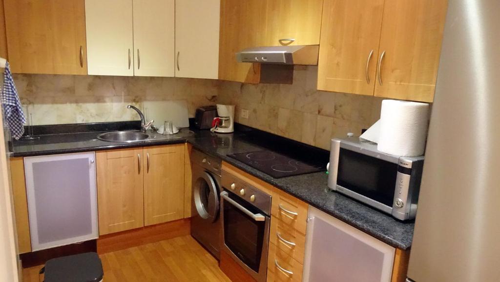 Kuchyň nebo kuchyňský kout v ubytování Apt 409 Los Gigantes