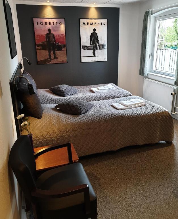 Postel nebo postele na pokoji v ubytování Hotel Aabenraa