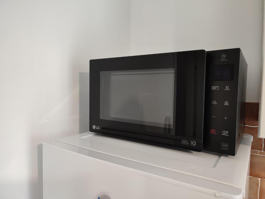 Televízia a/alebo spoločenská miestnosť v ubytovaní MOLO 78 Case Vacanze