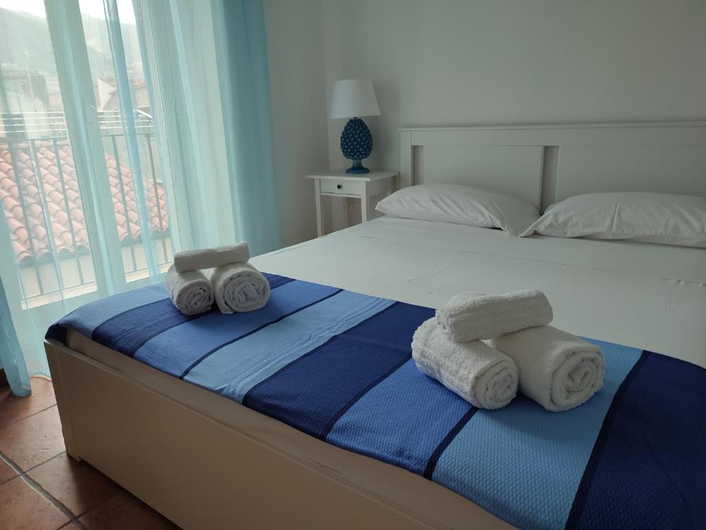 Posteľ alebo postele v izbe v ubytovaní MOLO 78 Case Vacanze