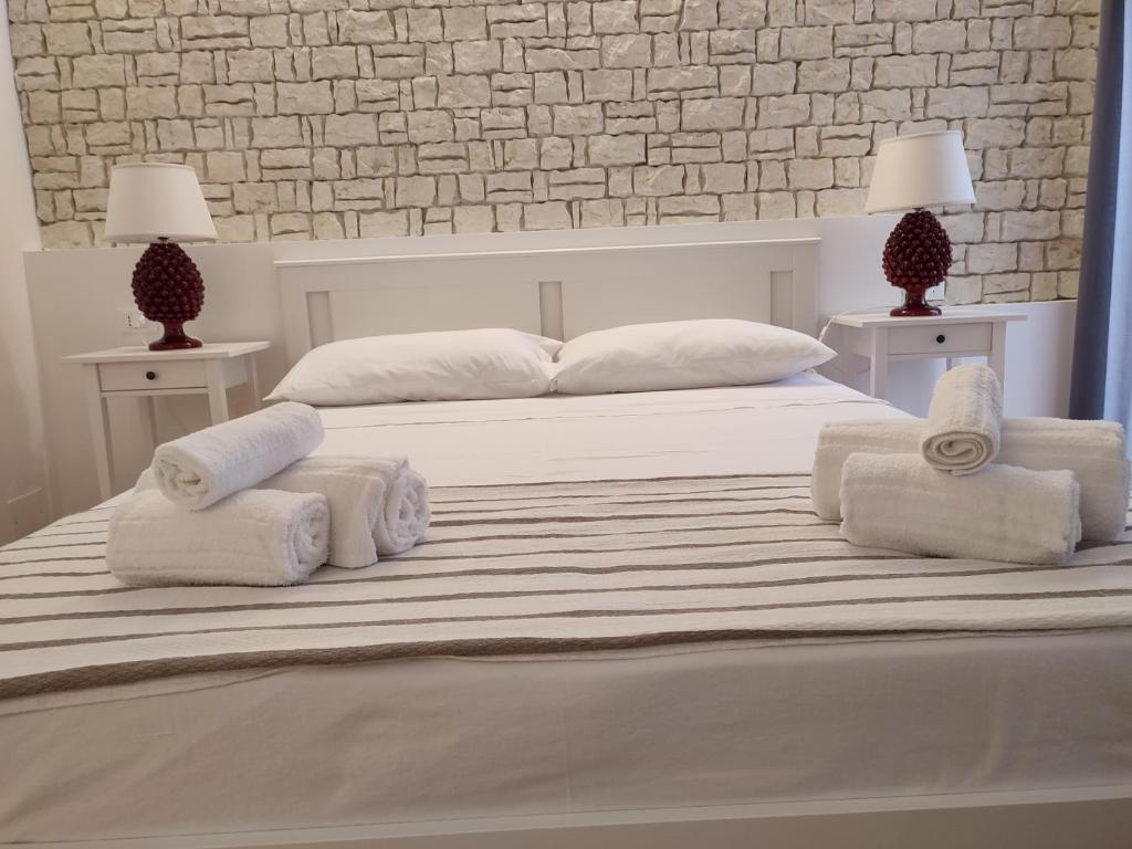Posteľ alebo postele v izbe v ubytovaní MOLO 78 Case Vacanze