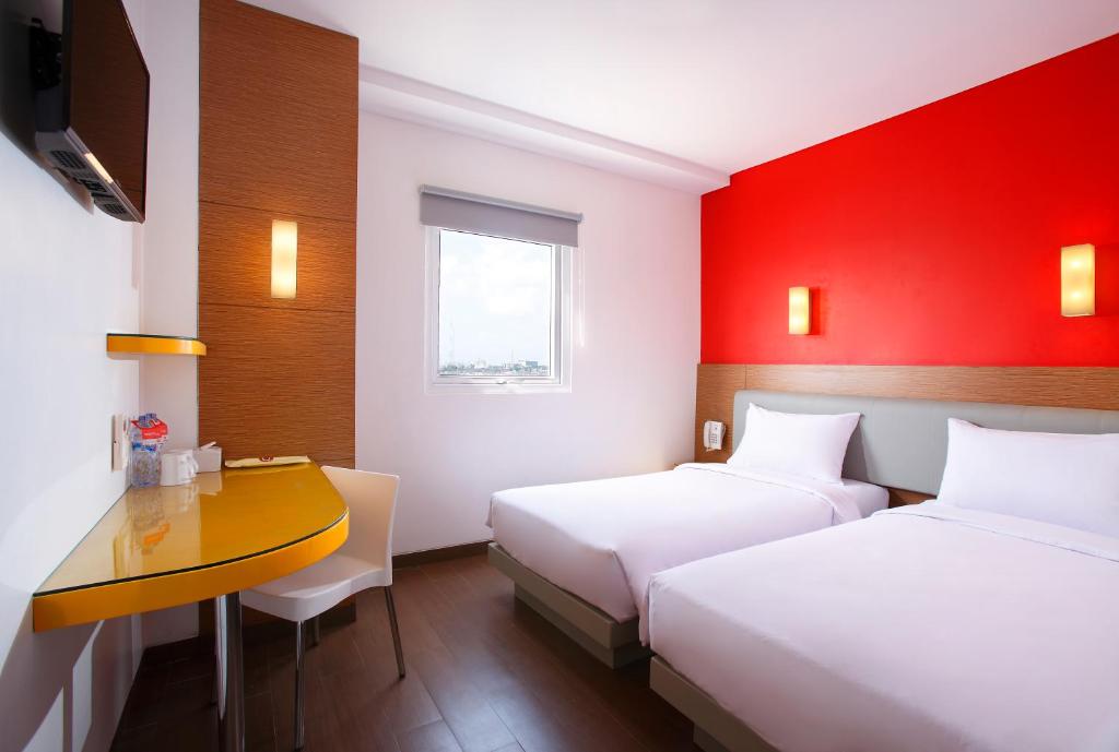 Postel nebo postele na pokoji v ubytování Amaris Hotel Palembang