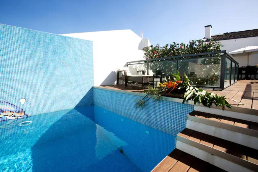 a house with a swimming pool and a patio at 2Stay - Luxury in Ponta Delgada