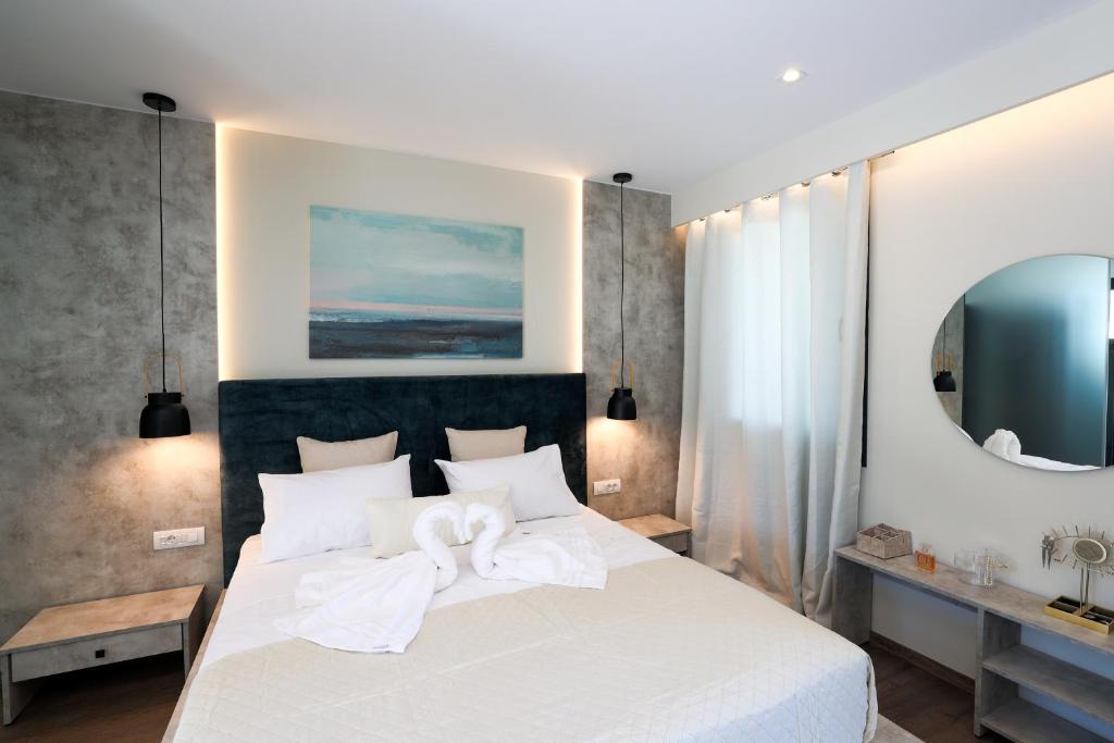 Postel nebo postele na pokoji v ubytování SAMI BEACHVIEW