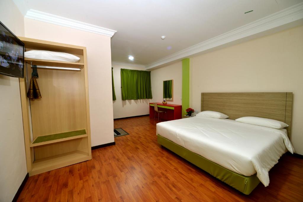 Postel nebo postele na pokoji v ubytování Classic Boutique Hotel Kuantan