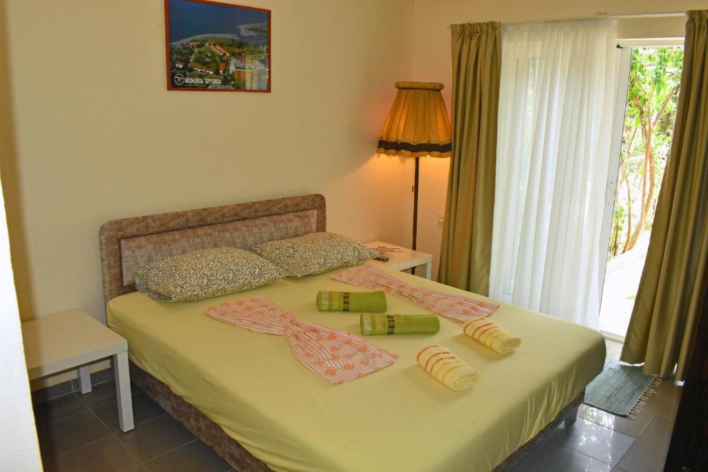 Postelja oz. postelje v sobi nastanitve Riverside Apartments Chiara