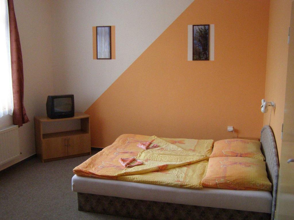 Postel nebo postele na pokoji v ubytování Hotel Morava