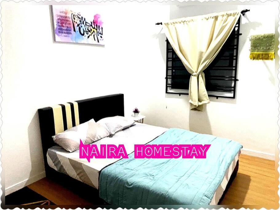 Postel nebo postele na pokoji v ubytování Naira Homestay Kota Bharu ,Wakaf Che Yeh 4 Bilik 3 Aircond