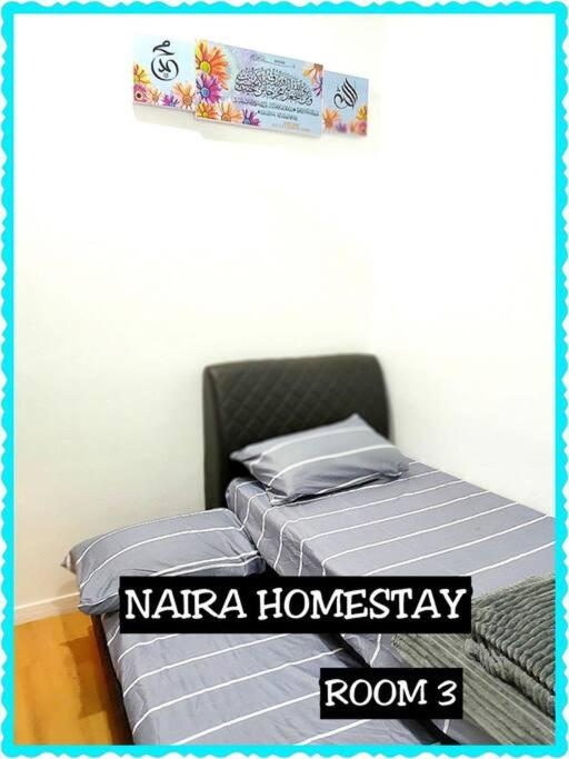 Postel nebo postele na pokoji v ubytování Naira Homestay Kota Bharu ,Wakaf Che Yeh 4 Bilik 3 Aircond
