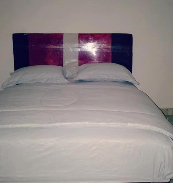 Postel nebo postele na pokoji v ubytování Eltari Homestay
