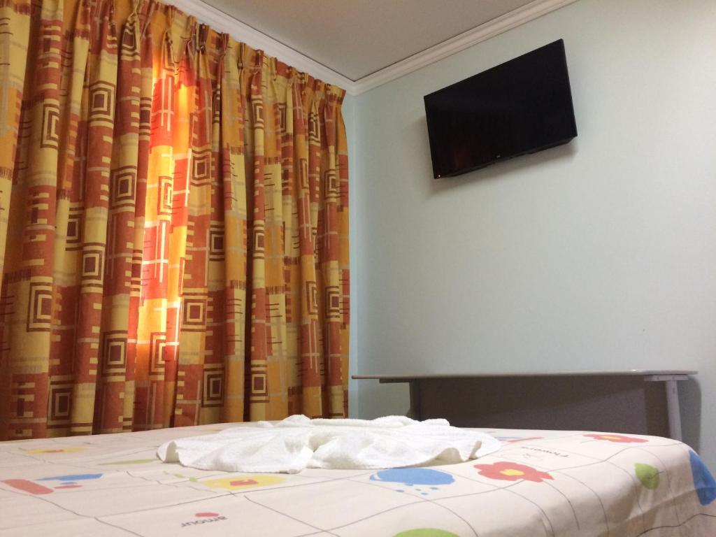 TV a/nebo společenská místnost v ubytování Rosa's Hotel