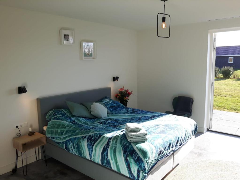 Postel nebo postele na pokoji v ubytování Bed no breakfast de Kapitein