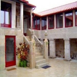 a building with a staircase in front of a building at Casa Do Seminario in Gralhas