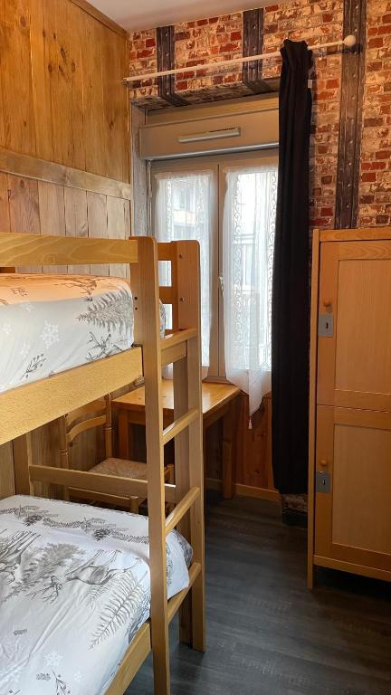 Postel nebo postele na pokoji v ubytování Hôtel Quin Te Va