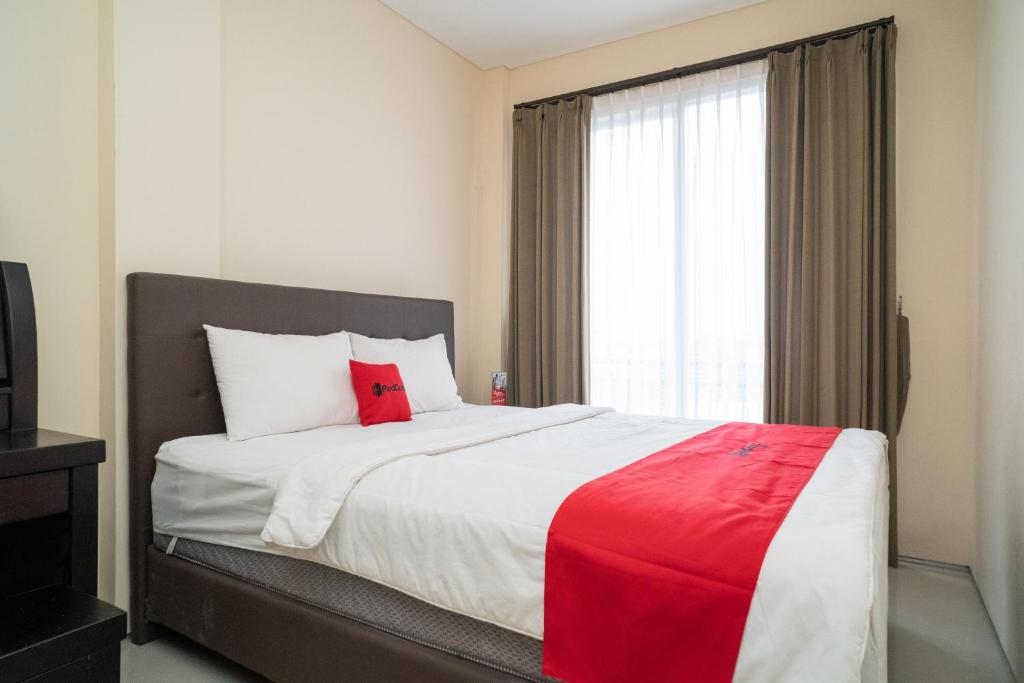Postel nebo postele na pokoji v ubytování RedDoorz near ITDC Nusa Dua
