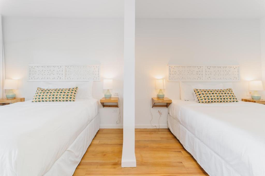 Voodi või voodid majutusasutuse The Beach House Boutique Hotel toas