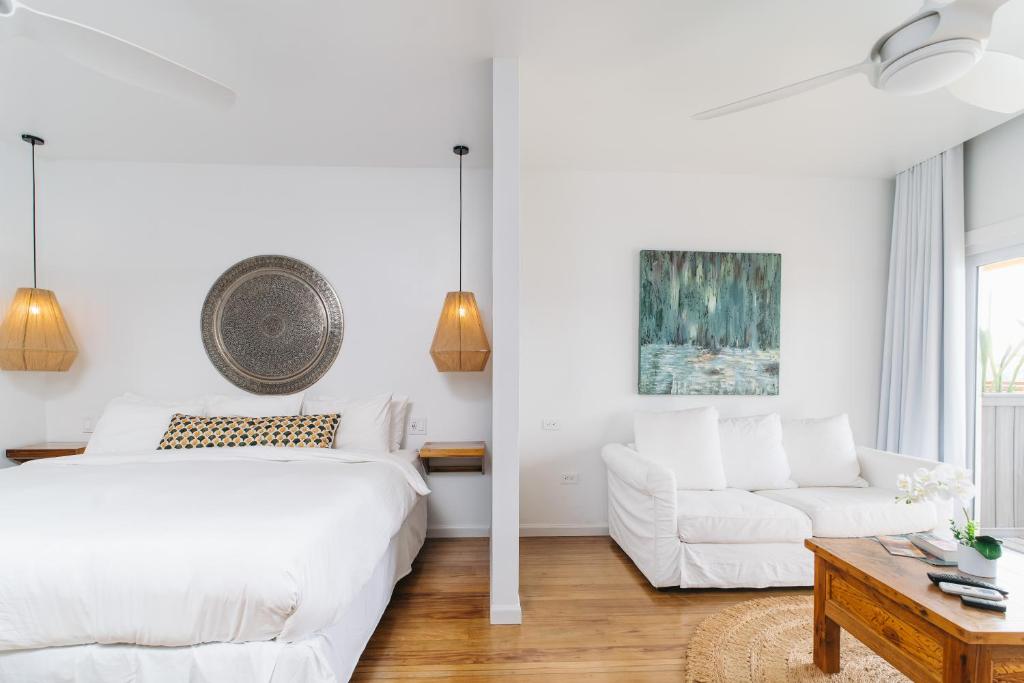 Voodi või voodid majutusasutuse The Beach House Boutique Hotel toas