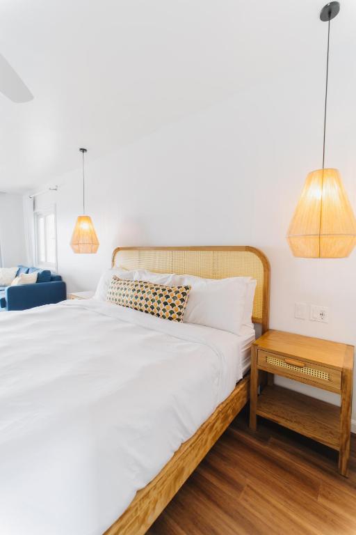 Voodi või voodid majutusasutuse The Beach House Boutique Hotel toas