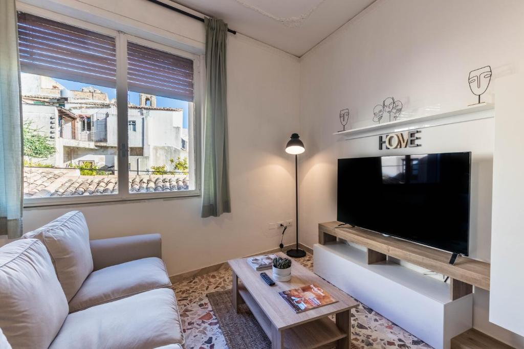 A television and/or entertainment centre at Trigona 4 Apartment