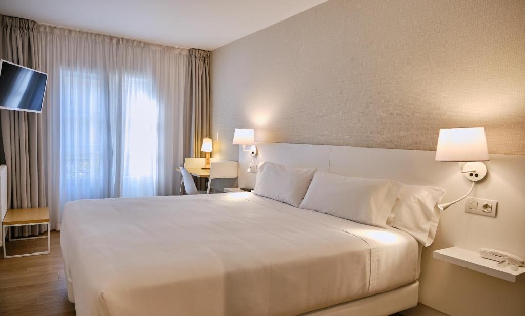 Cama o camas de una habitación en Hostal Suso