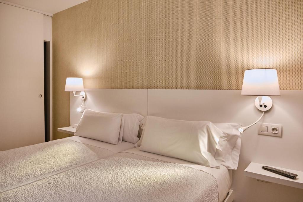 Cama o camas de una habitación en Hostal Suso