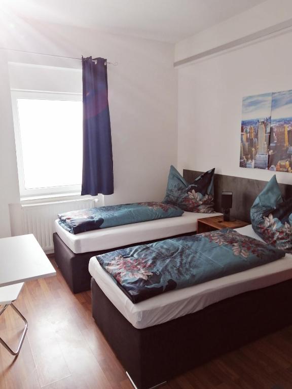 Postel nebo postele na pokoji v ubytování Motel Graz Ost