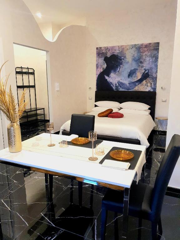 Posteľ alebo postele v izbe v ubytovaní Setteabbracci Suite & Apartments