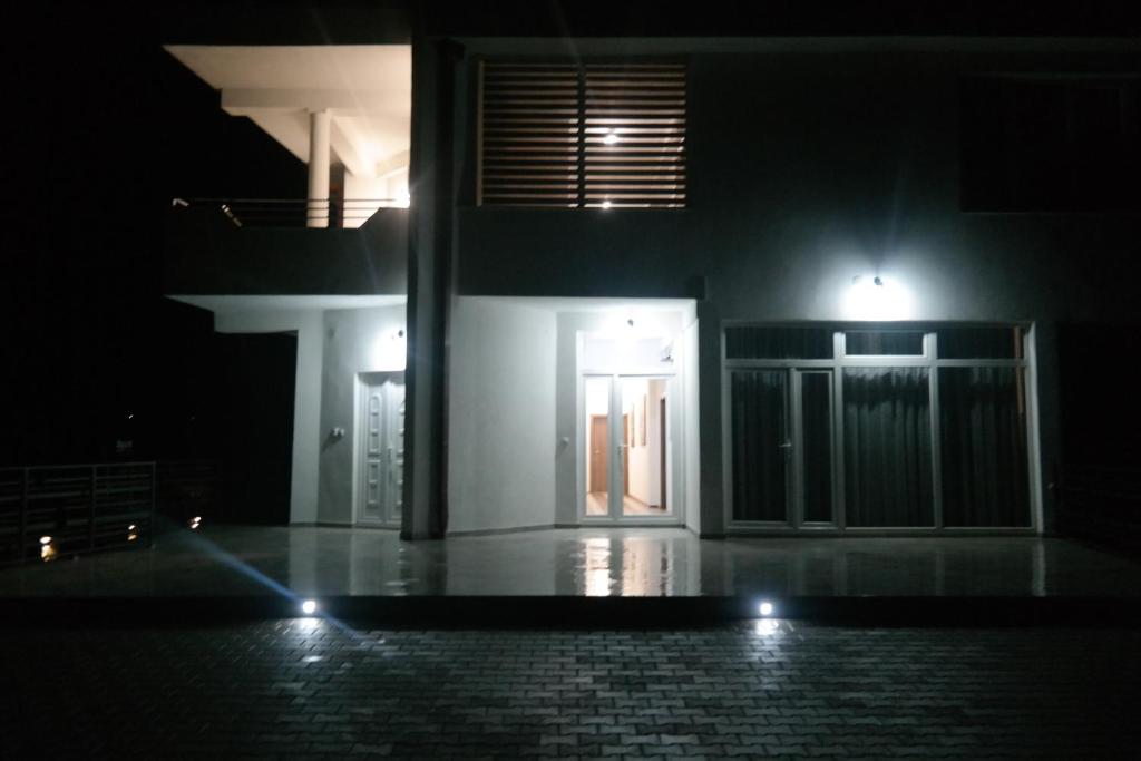 a house with a door at night with lights at Villa FAMILY in Kumanovo