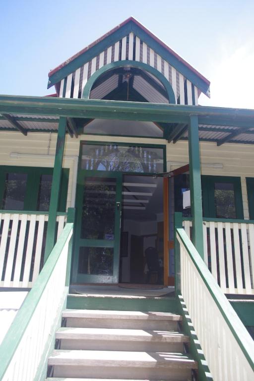 a building with stairs leading up to a door at The Grand Halls Gap in Halls Gap