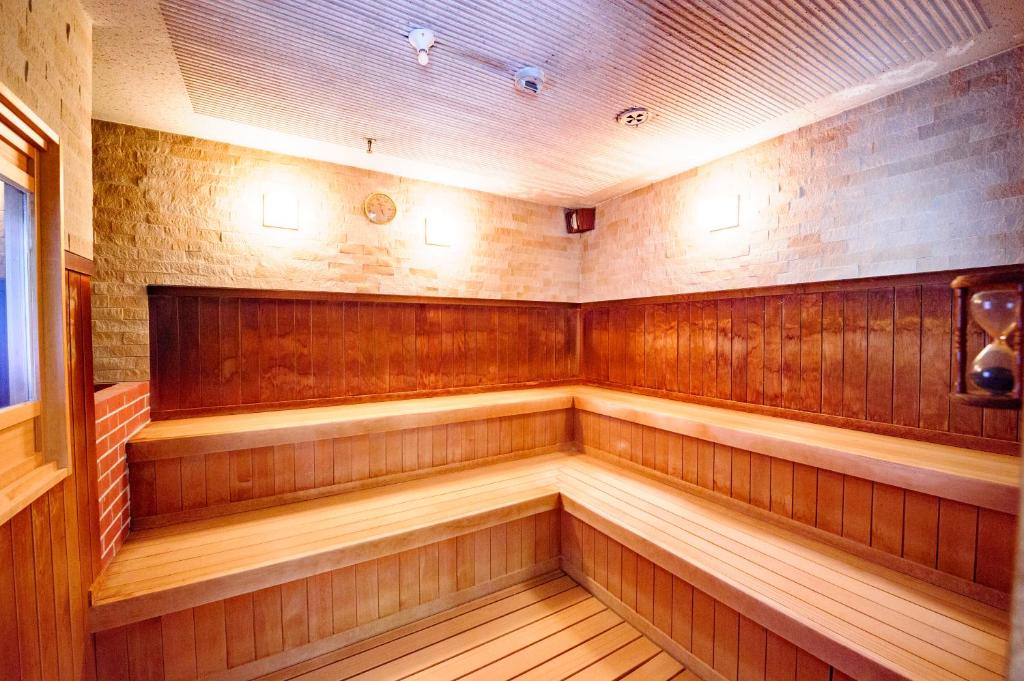 a sauna with wood paneled walls at Kanazawa Hakuchoro Hotel Sanraku -Natural Hot Spring- in Kanazawa