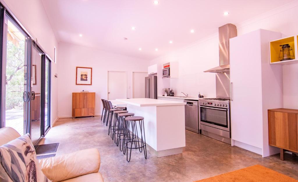 a kitchen with white walls and a counter top at Hamelin Bay Seaclusion in Hamelin Bay