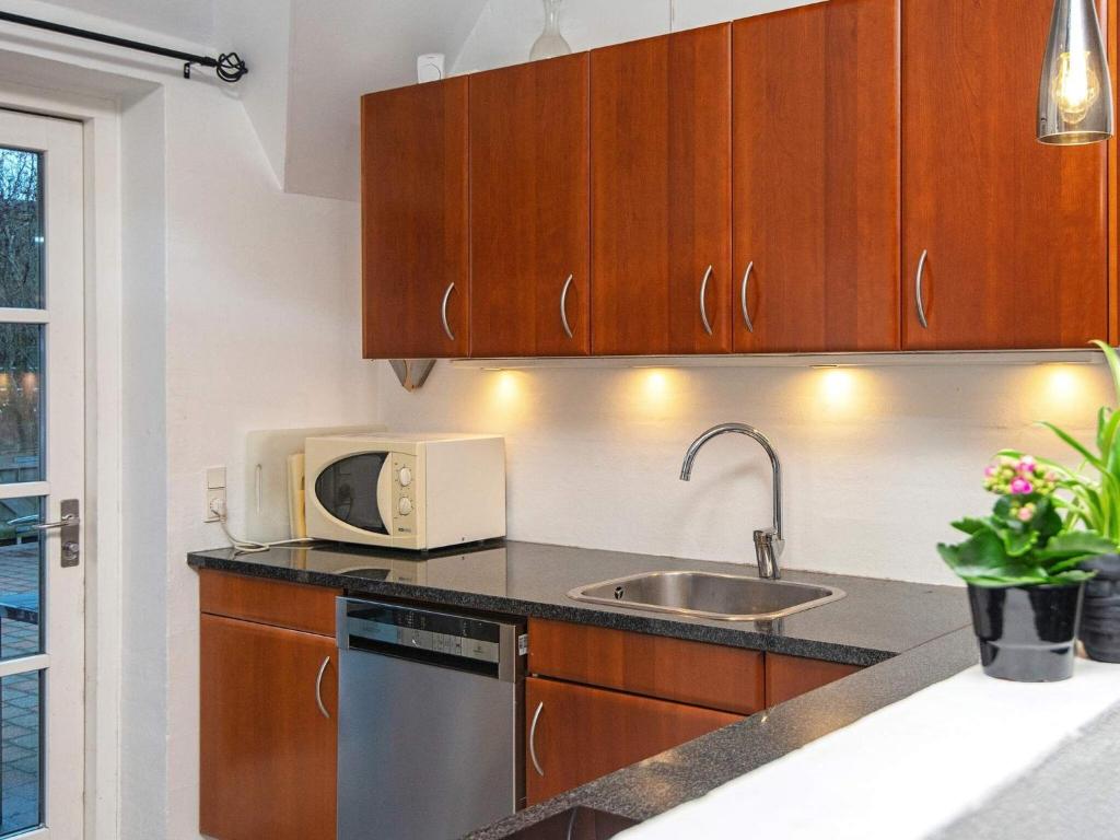Kuchyň nebo kuchyňský kout v ubytování 18 person holiday home in Ulfborg-By Traum
