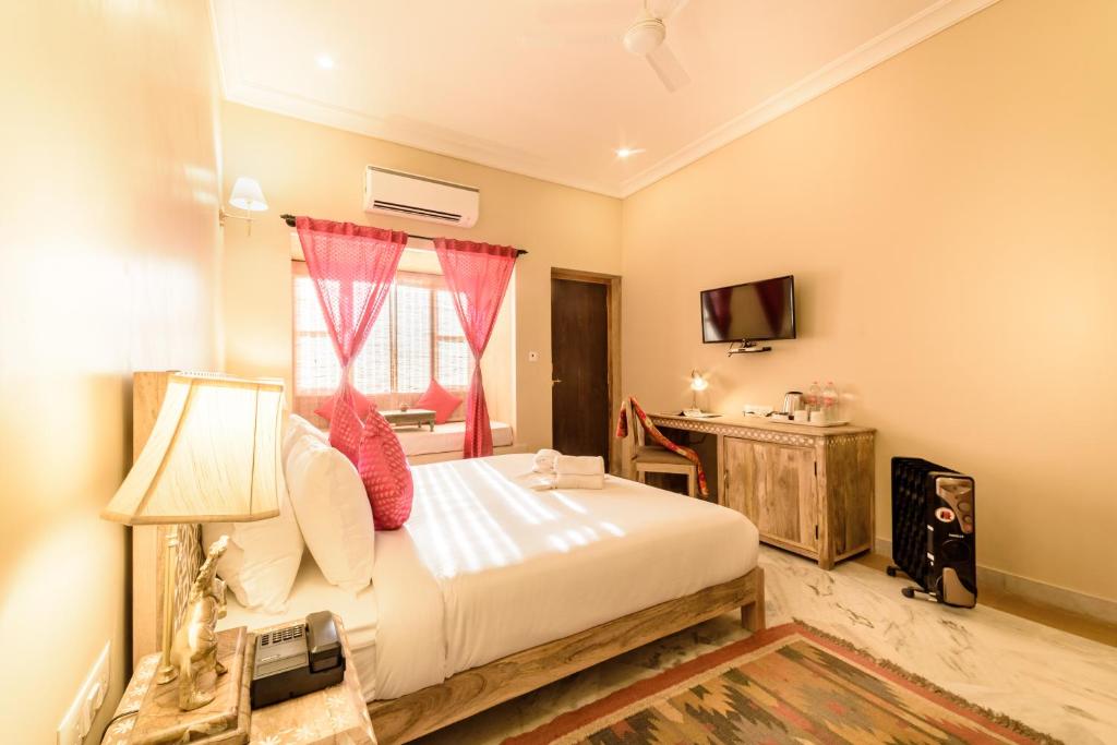 Postel nebo postele na pokoji v ubytování Hotel Jasmin Home