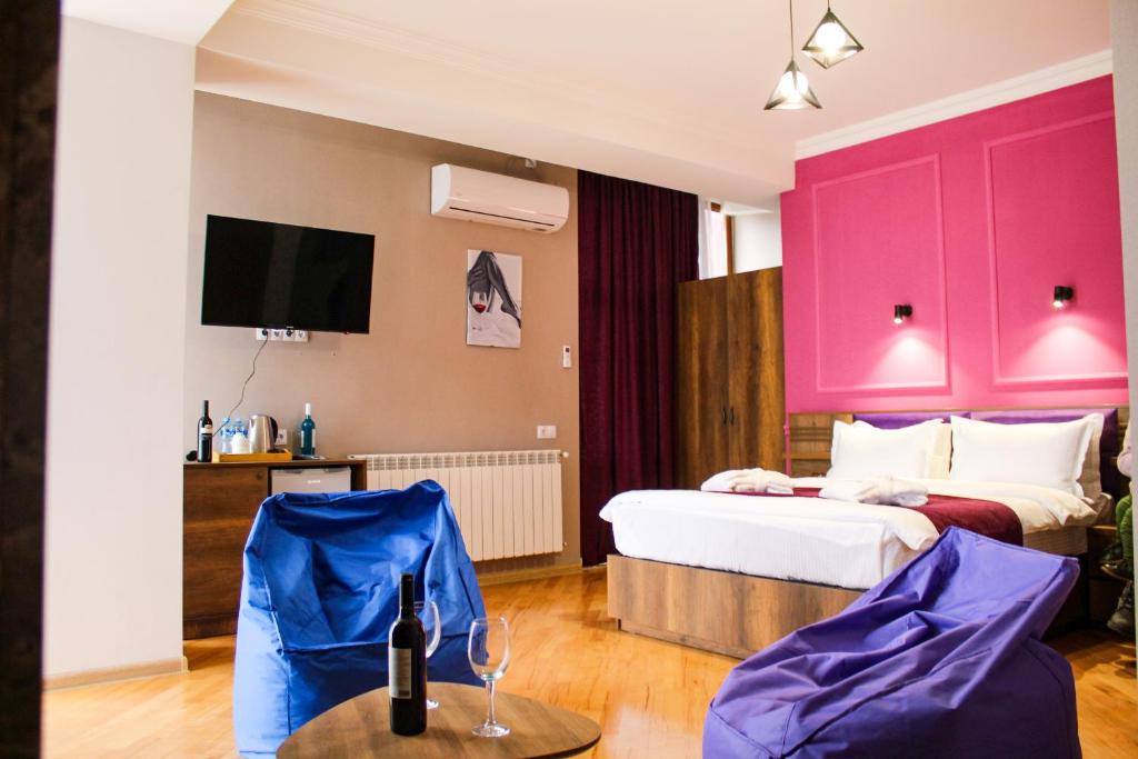 Postel nebo postele na pokoji v ubytování Legend Hotel
