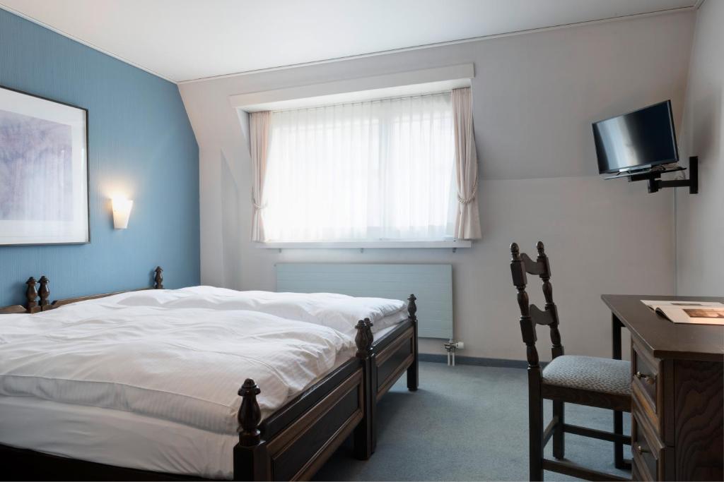 Katil atau katil-katil dalam bilik di KunstHotel Linde Garni