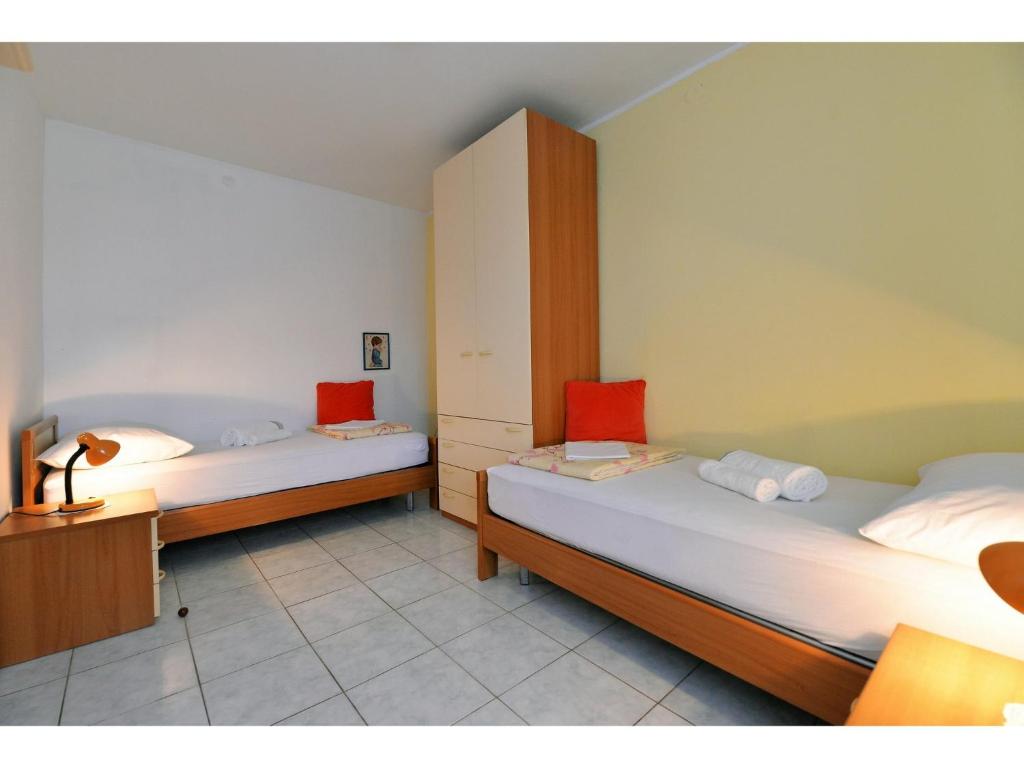 Posteľ alebo postele v izbe v ubytovaní Apartments Kostelic