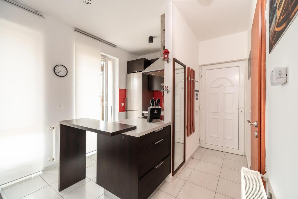 Kuchyň nebo kuchyňský kout v ubytování Grand 56 Apartman-Keszthely