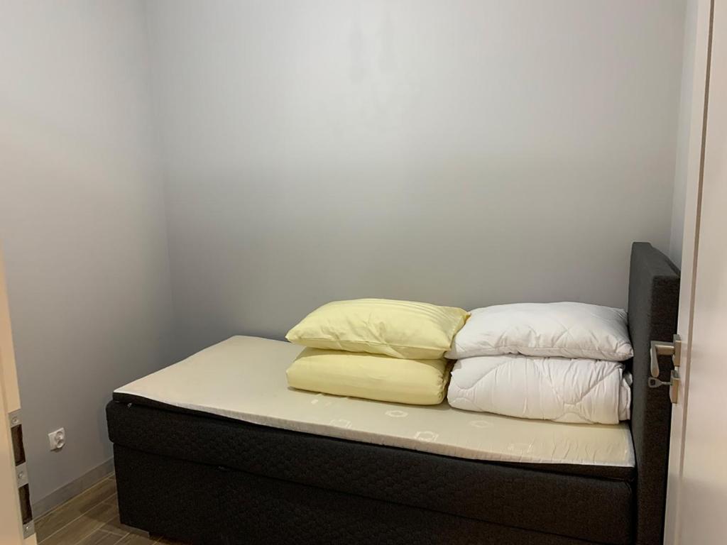 Posteľ alebo postele v izbe v ubytovaní Apartamenty Nadjeziorna