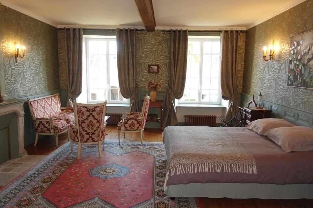 Postel nebo postele na pokoji v ubytování Manoir De Savigny