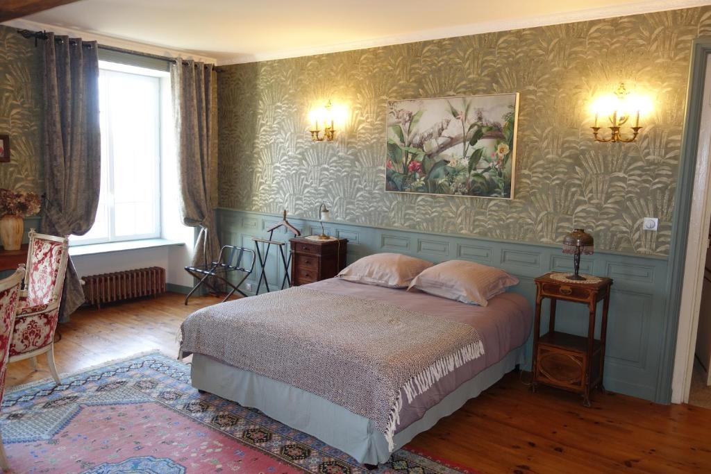 Postel nebo postele na pokoji v ubytování Manoir De Savigny