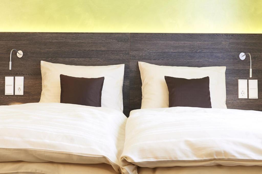 Posteľ alebo postele v izbe v ubytovaní eee Hotel Marchtrenk