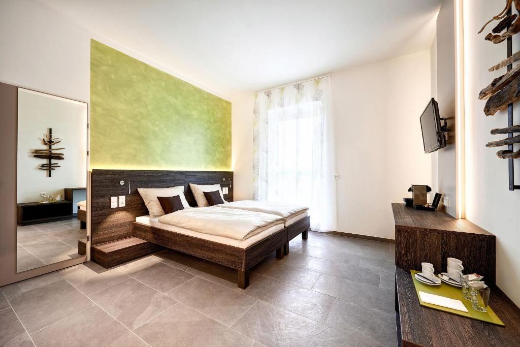 Posteľ alebo postele v izbe v ubytovaní eee Hotel Marchtrenk