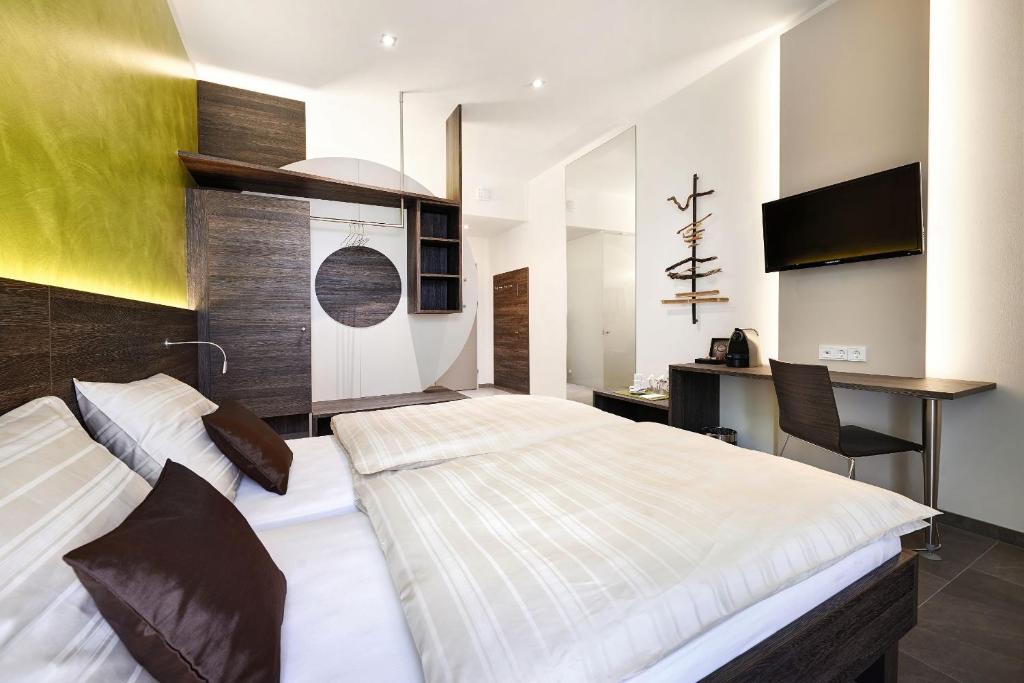 מיטה או מיטות בחדר ב-eee Hotel Marchtrenk