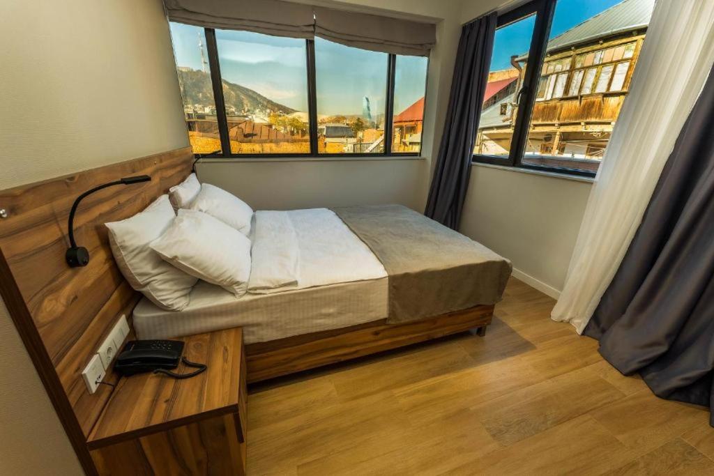 Postel nebo postele na pokoji v ubytování Address Boutique Hotel