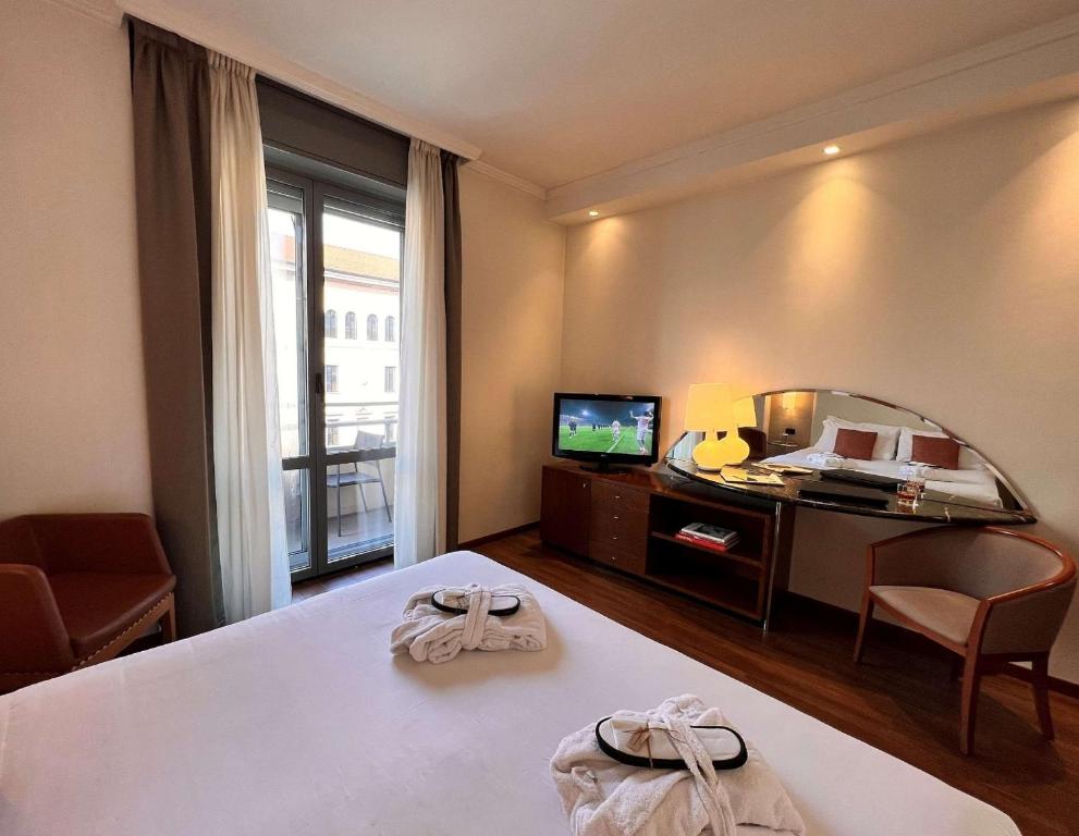 TV a/nebo společenská místnost v ubytování Best Western Hotel City