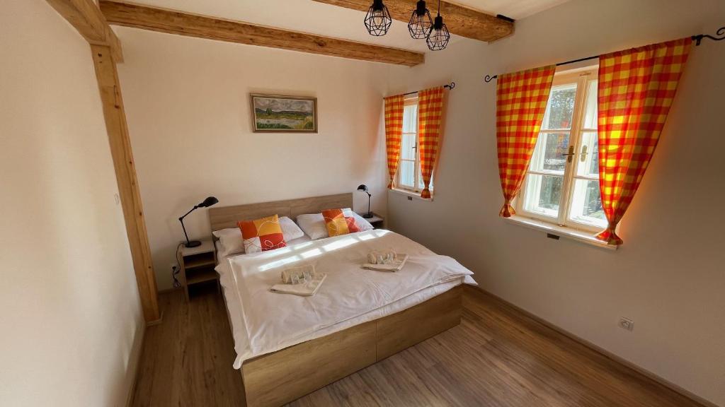 Postel nebo postele na pokoji v ubytování Penzion Pod Devítkou