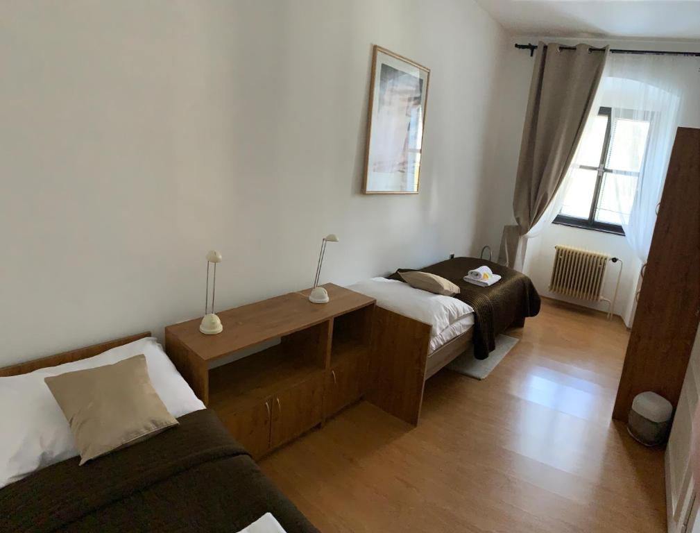 Postel nebo postele na pokoji v ubytování Hotel U Apoštola