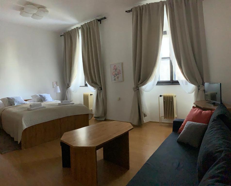 Postel nebo postele na pokoji v ubytování Hotel U Apoštola