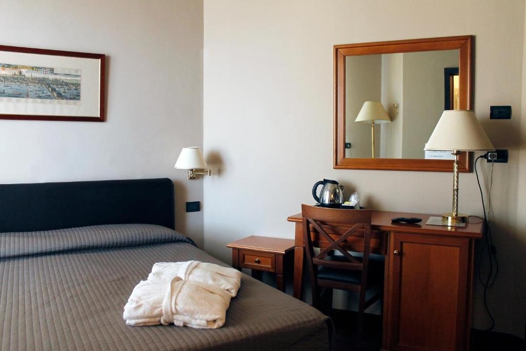 Postel nebo postele na pokoji v ubytování Hotel San Giorgio