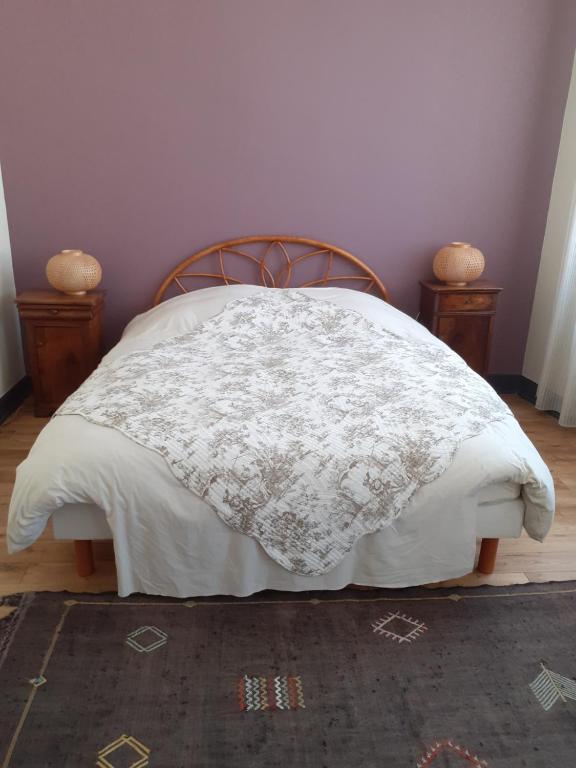 Ein Bett oder Betten in einem Zimmer der Unterkunft Le Patio Gironnais